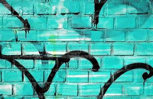 mur de graffitis turquoise et noir photo