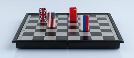 drapeau de symboles de la russie, des états-unis, de la chine et de l'angleterre sur l'échiquier. le concept de jeu politique. photo