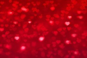 coeur bokeh fond rouge pour carte de voeux saint valentin photo