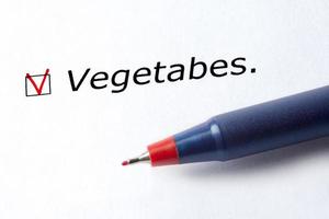 le mot légumes est imprimé sur un fond blanc. photo