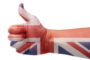 drapeau britannique et la main avec le pouce vers le haut. photo