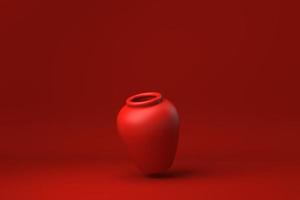 poterie rouge flottant sur fond rouge. idée de concept minimal créatif. monochrome. rendu 3D. photo