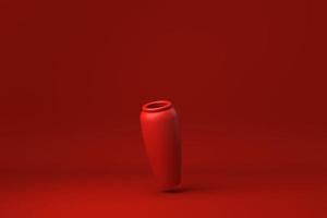 poterie rouge flottant sur fond rouge. idée de concept minimal créatif. monochrome. rendu 3D. photo