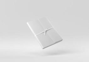 cahier blanc flottant sur fond blanc. idée de concept minimal créatif. monochrome. rendu 3D. photo