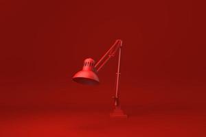 lampe de bureau rouge sur fond rouge. idée de concept minimal créatif. monochrome. rendu 3D. photo