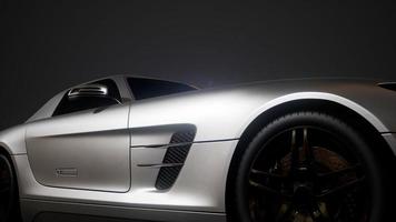 voiture de sport de luxe dans un studio sombre avec des lumières vives photo