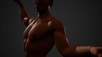 Beau jeune homme musclé torse nu debout dans le noir photo