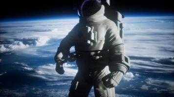 astronaute dans l'espace sur fond de planète terre photo