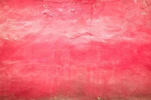 fond de texture de mur de ciment grunge de couleur rose. photo