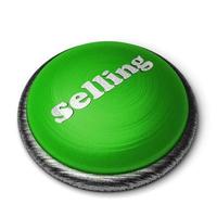 Mot de vente sur le bouton vert isolé sur blanc photo