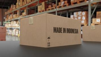 boîtes avec texte fabriqué en indonésie sur convoyeur. rendu 3d photo