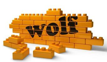 mot de loup sur le mur de briques jaunes photo