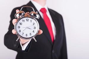 homme d'affaires avec une horloge photo