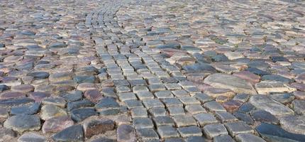 texture de fond de briques pavées de carreaux de chaussée en pierre photo
