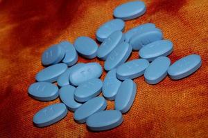pilules médicales bleues bouchent arrière-plan impression grande taille de haute qualité photo