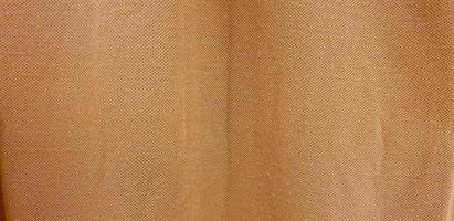 texture de tissu doux tissé marron. fond de coton marron. copier l'espace pour l'image ou le texte
