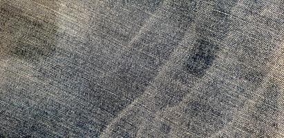 texture de tissu denim sale. vieux fond de texture de jeans bleus photo