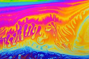 couleurs arc-en-ciel. fond de motifs multicolores psychédéliques. photo macro shot de bulles de savon