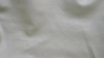 texture de tissu de toile de coton blanc. fond de tissu de tissu froissé photo