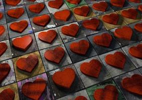 mosaïque de coeurs de la saint-valentin en bois rouge sur un motif de blocs texturés éclaboussés et grunge peints multicolores. photo