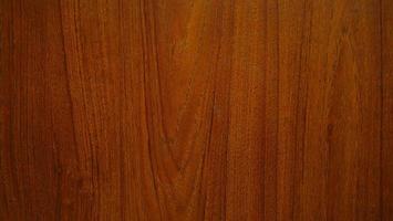 texture de grain de bois pour faire du fond ou du papier peint. motif de grain de bois, ton rouge et noir. motif en bois de teck rouge. photo