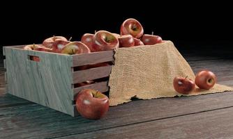 pommes rouges dans une boîte en bois avec tissu de jute sur une surface en bois. image de rendu 3d photo