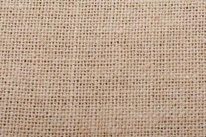 toile de jute, fond de texture de tissu de coton granuleux marron photo