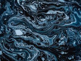 texture abstraite en pierre de marbre bleu et noir pour le fond. photo