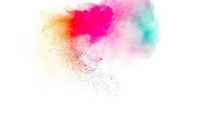 explosion de poudre multicolore sur fond blanc. photo