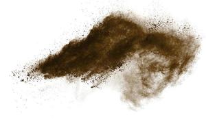 geler le mouvement de l'explosion de poussière brune. arrêter le mouvement de la poudre brune. photo
