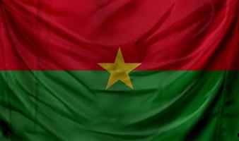 drapeau du burkina faso agitant. arrière-plan pour la conception patriotique et nationale photo