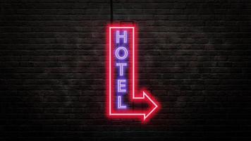 emblème de l'enseigne de l'hôtel dans un style néon sur fond de mur de briques photo