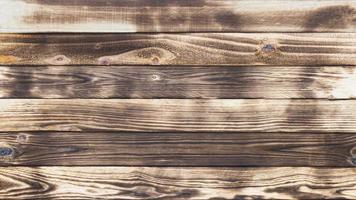 vieux planchers de bois avec des traces de noir brûlé sur des arrière-plans et des textures abstraits. photo