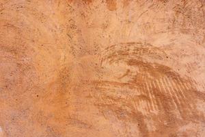 fond de texture de mur de plâtre extérieur brun beige avec motif de rayures et de fissures photo