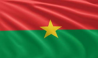 gros plan agitant le drapeau du burkina faso photo