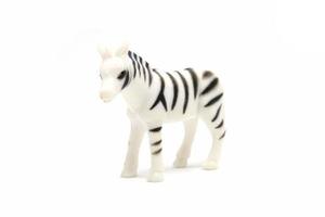 modèle de zèbre isolé sur fond blanc, jouets pour animaux en plastique photo