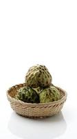 sucre frais pomme fruit ou anone ou annona cherimoya ,sweetsop in basket photo