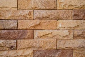 le mur de briques en pierre de granit fond texturé. photo