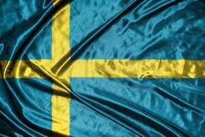 Suède drapeau en tissu drapeau en satin agitant la texture du tissu du drapeau photo