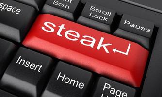 mot steak sur le bouton clavier rouge photo
