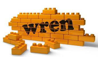 Wren word sur mur de briques jaunes photo