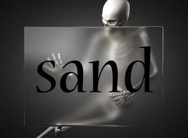 mot de sable sur verre et squelette photo