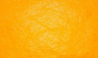 fond d'écran de texture peau ou peau d'orange. jaune doré. rendu 3d. photo