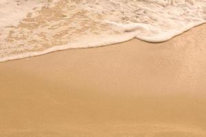 fond de vague de mer sur le sable photo