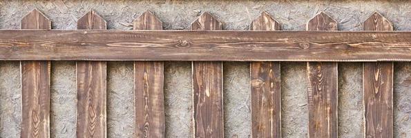 une vieille clôture en bois. fond en bois marron. photo