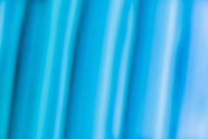 bannière de fond abstraite horizontale dans les tons bleus, vagues lisses avec des paillettes. photo
