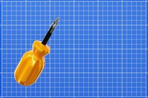 Illustration 3d d'un tournevis avec une poignée jaune en style cartoon sur papier millimétré. outil de menuiserie à main pour magasin de bricolage.