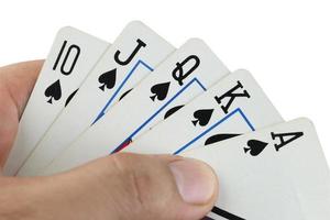 cartes à jouer flush royal à la main.