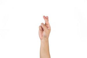 doigt croisé de main masculine thaïlandaise asiatique pour la bonne chance sur le fond blanc clair. photo