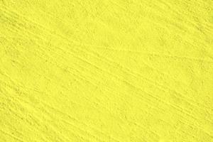 mur d'or ou fond de feuille d'or jaune brillant, texture de papier doré, surface de ciment abstraite, motif en béton, ciment peint photo